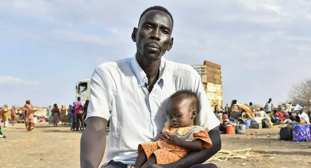 Un padre y su hija en Sudán. (X)