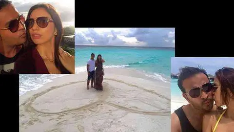 La pareja fotografiada en la playa.