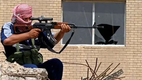 En la foto de Reuters un soldado en Irak.