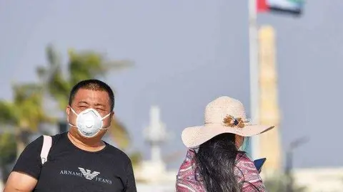 En la imagen de AFP, turistas chinos en EAU.