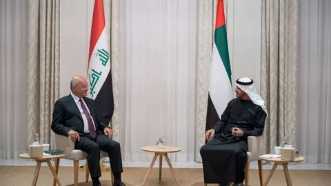 Los dos mandatarios en Abu Dhabi. (WAM)